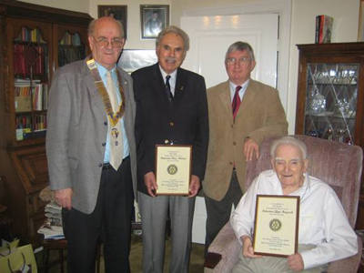 Mr Heycock and Mr Thomas show their certificates for their service to the Rotary